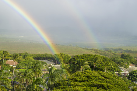 Double rainbow over the land.