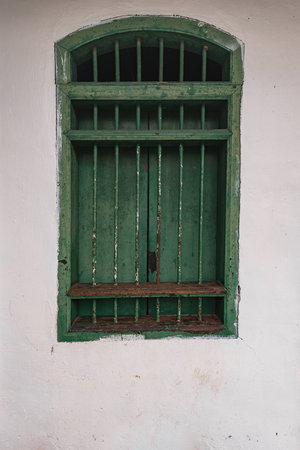Old green window in a houseの写真素材