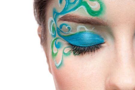 Close-up half part of face portrait of beautiful sprite girl with green faceart on white