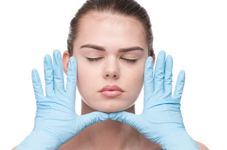 Medical examination face of beautiful woman - close-up portrait isolated on white