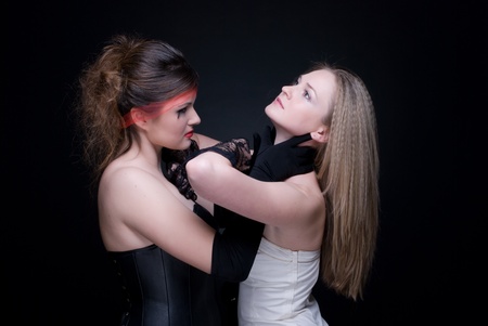 Closeup portrait of two girls: black & white or good & evilの写真素材