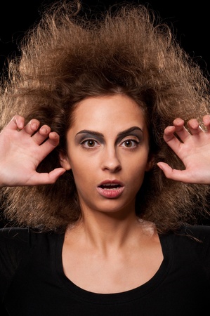 Closeup portrait of beautiful doll woman on blackの写真素材