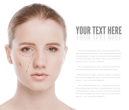 Beautician draw correction lines on woman face. Before plastic surgery operetion. Isolated on whiteの写真素材