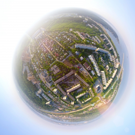 Aerial city view with crossroads, roads, houses, buildings, parks, parking lots, bridges - little planet  spherical modeの写真素材