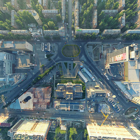 Aerial city view with crossroads, roads, houses, buildings, parks, parking lots, bridgesの写真素材