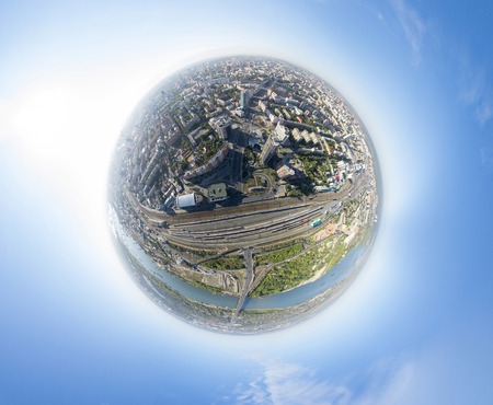 Aerial city view with crossroads and roads, houses and buildings, green parksの写真素材