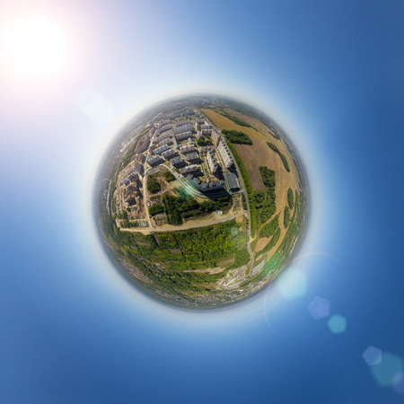 Aerial city view with crossroads and roads, houses, buildings, parks and parking lots, bridges....