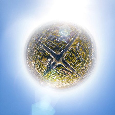 Aerial city view with crossroads, roads, houses, buildings, parks and parking lots, bridges. Copter...