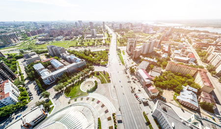 Aerial city view with roads, houses and buildings.の写真素材