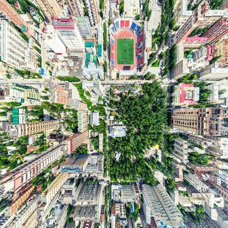 Aerial city view with crossroads and roads, houses, buildings, parks and parking lots, bridges. Helicopter drone shot. Wide Panoramic image.の写真素材