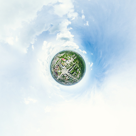 Aerial city view with crossroads and roads, houses, buildings, parks and parking lots, bridges....