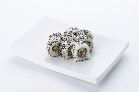 Sushi set and composition at white background. Japanese food restaurant, sushi maki gunkan roll plate or platter set.の写真素材