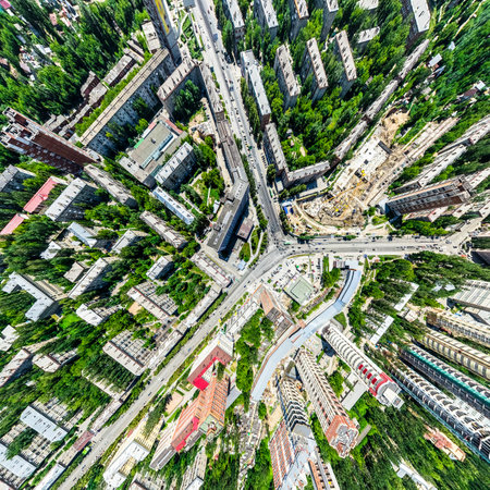 Aerial city view with crossroads and roads, houses, buildings, parks and parking lots, bridges. Helicopter drone shot. Wide Panoramic image.の写真素材