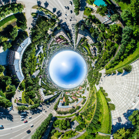 Aerial city view with crossroads, roads, houses, buildings, parks and parking lots. Copter drone helicopter shot. Panoramic wide angle image.の写真素材