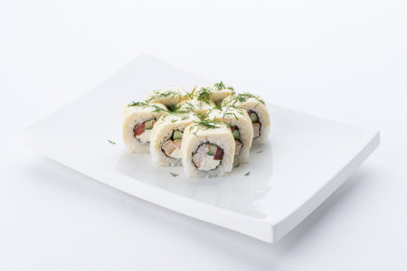 Sushi set and composition at white background. Japanese food restaurant, sushi maki gunkan roll plate or platter set.の写真素材