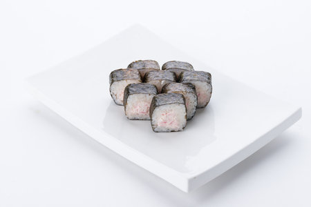 Sushi set and composition at white background. Japanese food restaurant, sushi maki gunkan roll plate or platter set.の写真素材