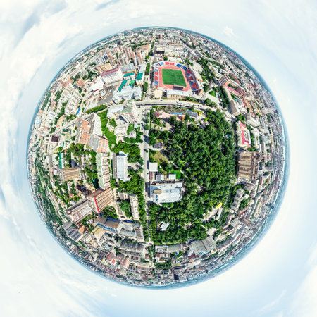 Aerial city view with crossroads and roads, houses, buildings, parks and parking lots, bridges. Helicopter drone shot. Wide Panoramic image.の写真素材