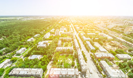 Aerial city view with crossroads and roads, houses, buildings, parks and parking lots, bridges. Helicopter drone shot. Wide Panoramic image.の写真素材
