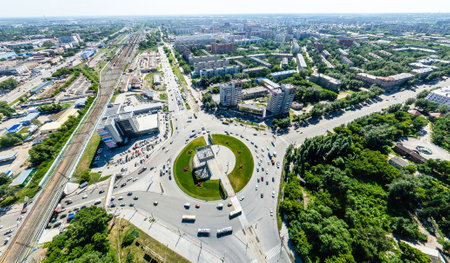 Aerial city view with crossroads, roads, houses, buildings, parks and parking lots. Copter drone helicopter shot. Panoramic wide angle image.の写真素材
