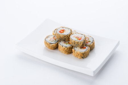 Sushi set and composition at white background. Japanese food restaurant, sushi maki gunkan roll plate or platter set.の写真素材