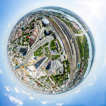 Aerial city view with crossroads, roads, houses, buildings, parks and parking lots. Copter drone...