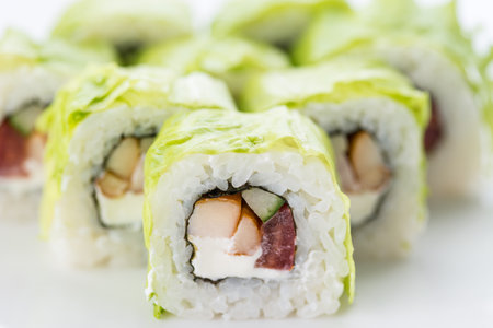 Sushi set and composition at white background. Japanese food restaurant, sushi maki gunkan roll plate or platter set.の写真素材