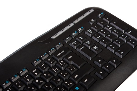 Computer keyboard isolated on white. Selective focus on the enter button.の写真素材