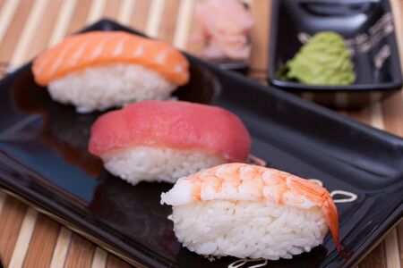 Fish sushi set on sushi plate. Selective focus.の写真素材