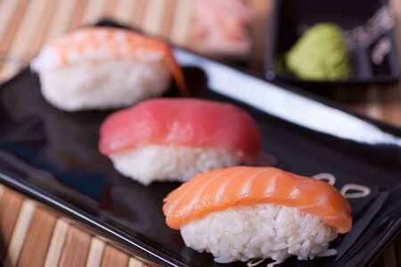 Fish sushi set on sushi plate. Selective focus.の写真素材