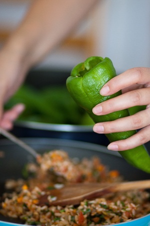 Woman cooking stuffed pepperの写真素材