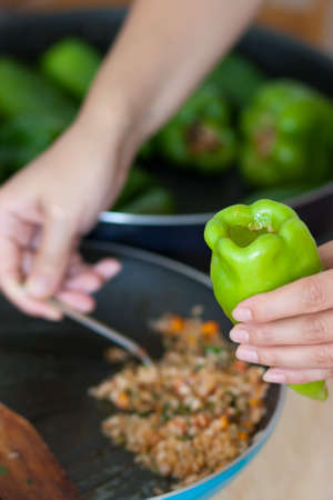 Woman cooking stuffed pepperの写真素材