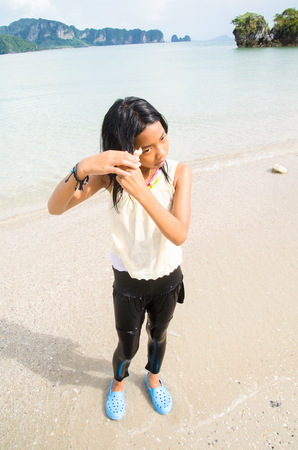 Small Little Girl play with  the sea during the  beach at  peipei island.のeditorial素材