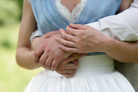 the hands of the bride and groom togetherの写真素材