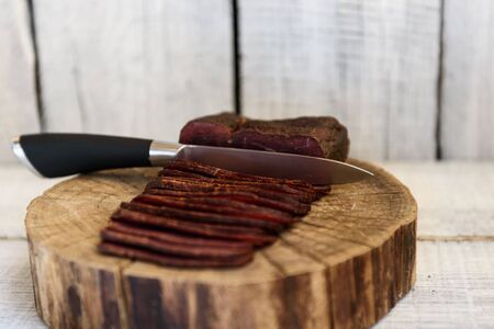 pastrami knife on a wooden tableの写真素材