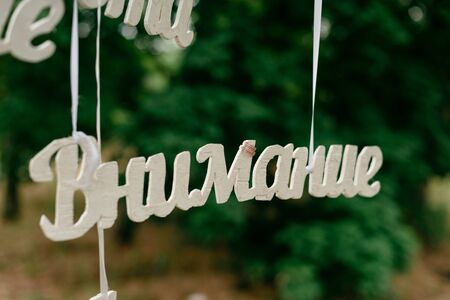 decorative lettering made of wood, the attention, and on her wedding ringの写真素材