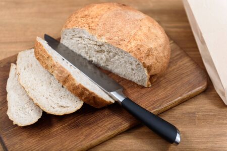 grain bread is sliced on the Boardの写真素材