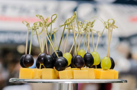 skewers with grapes and cheese on the stand at the Banquet