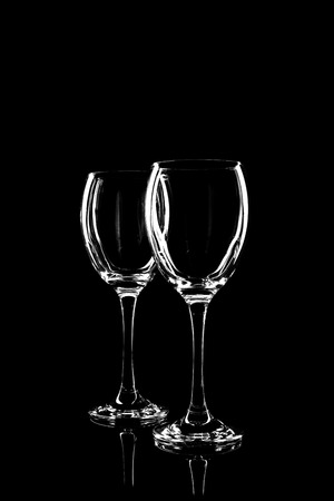 transparent glass for wine on black background with reflectionの写真素材