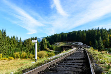 Railways in the Carpathian mountains, stretching into the distance against the blue skyの写真素材