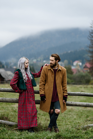 pair of lovers in the Carpathian mountains in national costumesの写真素材