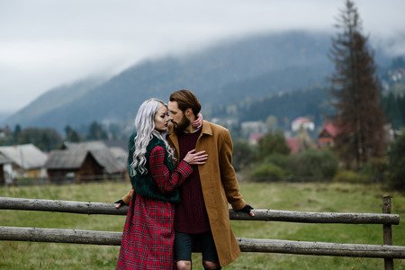 pair of lovers in the Carpathian mountains in national costumesの写真素材