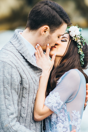 the bride kisses the groom, the passionate kiss of loversの写真素材