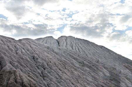 heap of gravel with water stains from rain on a background of blue sky careersの写真素材