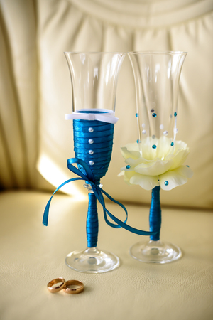 wedding glasses on the chair with gold rings Bridalの写真素材