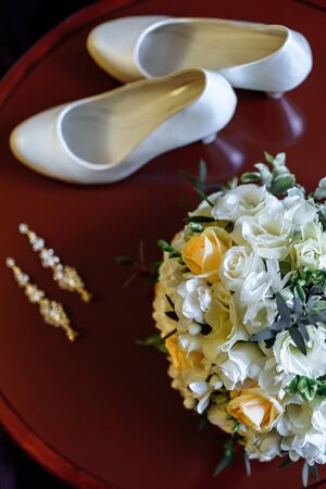 bouquet of delicate roses with elements of the wedding decorの写真素材
