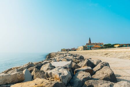 Belltower Duomo Santo Stefano on the seacoast coast in Caorle Italy