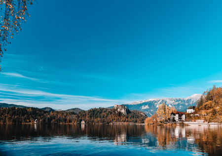 Lake Bled in the Alpine mountains in autumn under blue skyのeditorial素材