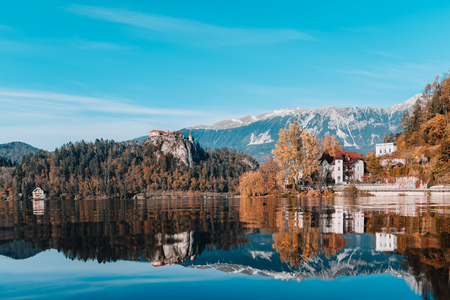 Lake Bled in the Alpine mountains in autumn under blue skyのeditorial素材