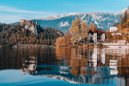 Lake Bled in the Alpine mountains in autumn under blue skyのeditorial素材