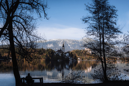 Lake Bled in the Alpine mountains in autumn under blue skyのeditorial素材